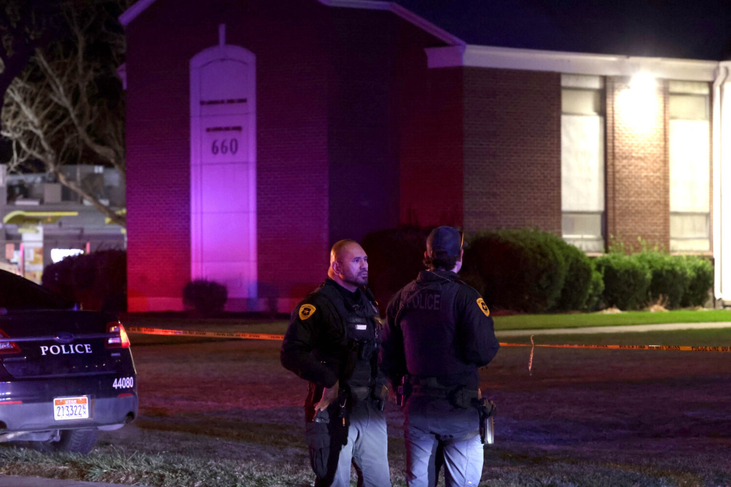 FILE - Police respond to a fatal shooting in a parking lot of The Church of Jesus Christ of Latter-...