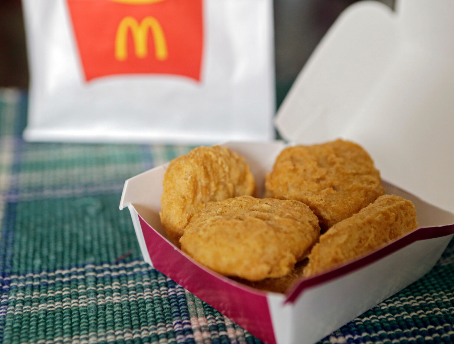 FILE - In this March 4, 2015, file photo, an order of McDonald's Chicken McNuggets is displayed for...