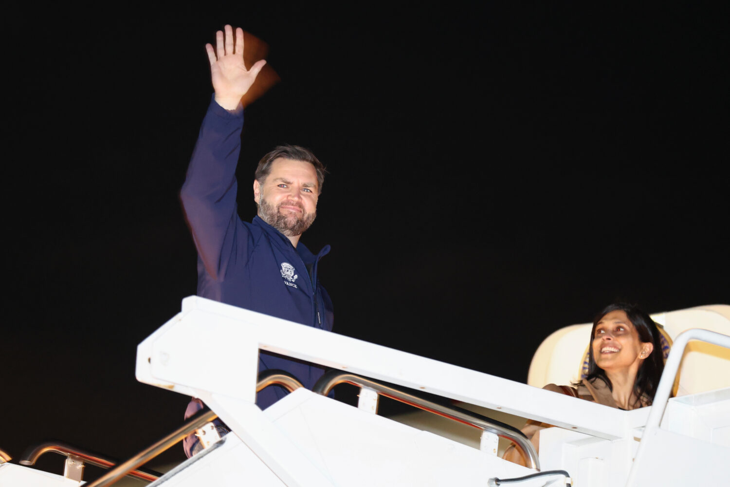Vice President JD Vance waves as he and second lady Usha Vance board Air Force Two to travel to the...