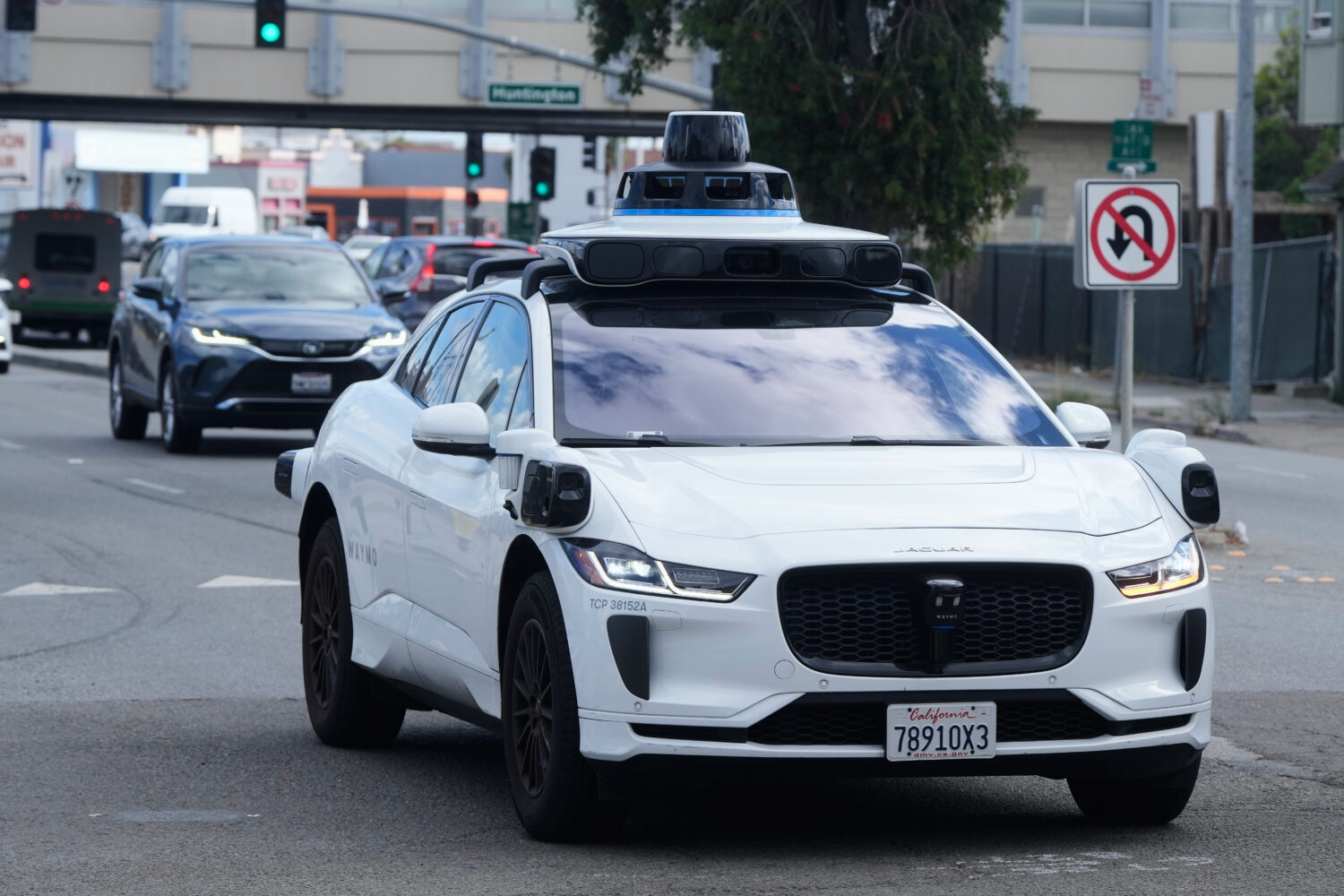 FILE - A Waymo vehicle drives past a No U-Turn sign in San Bruno, Calif., Tuesday, Sept. 30, 2025. ...