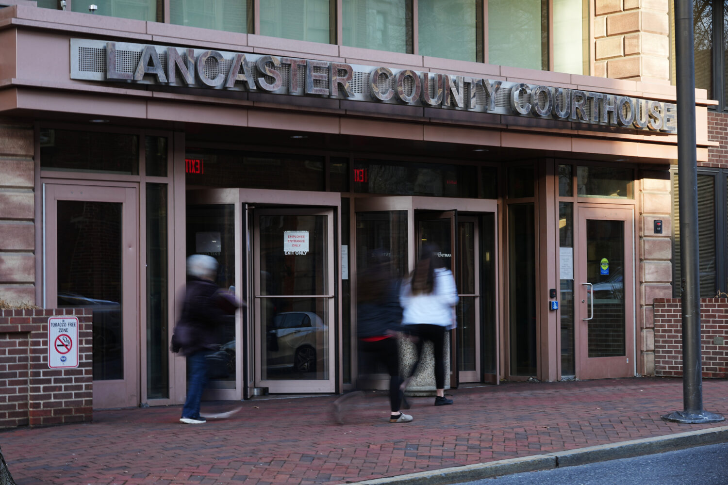People enter the Lancaster County Courthouse in Lancaster, Pa., Wednesday, March 25, 2026. (AP Phot...