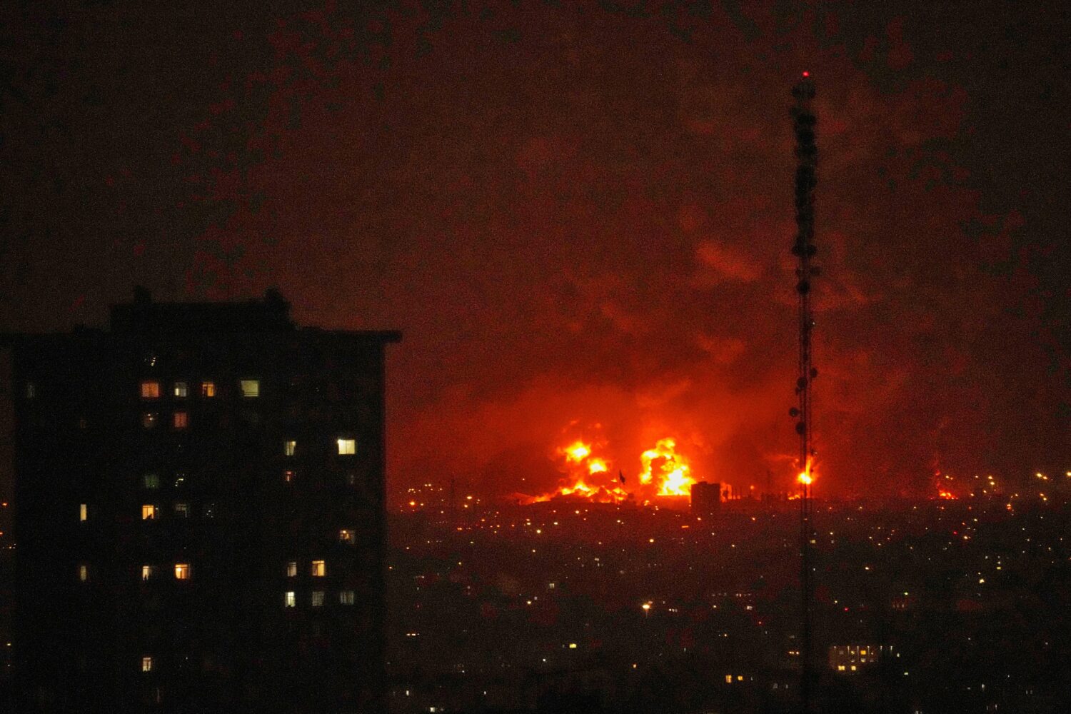 Flames rise from an oil storage facility south of the capital Tehran as strikes hit the city during...