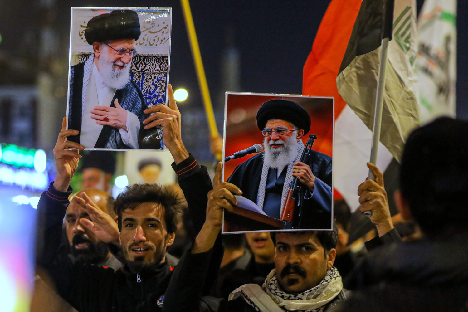 Iraqi Shiites hold pictures of Iranian Supreme Leader Ayatollah Ali Khamenei, who was killed by a U...
