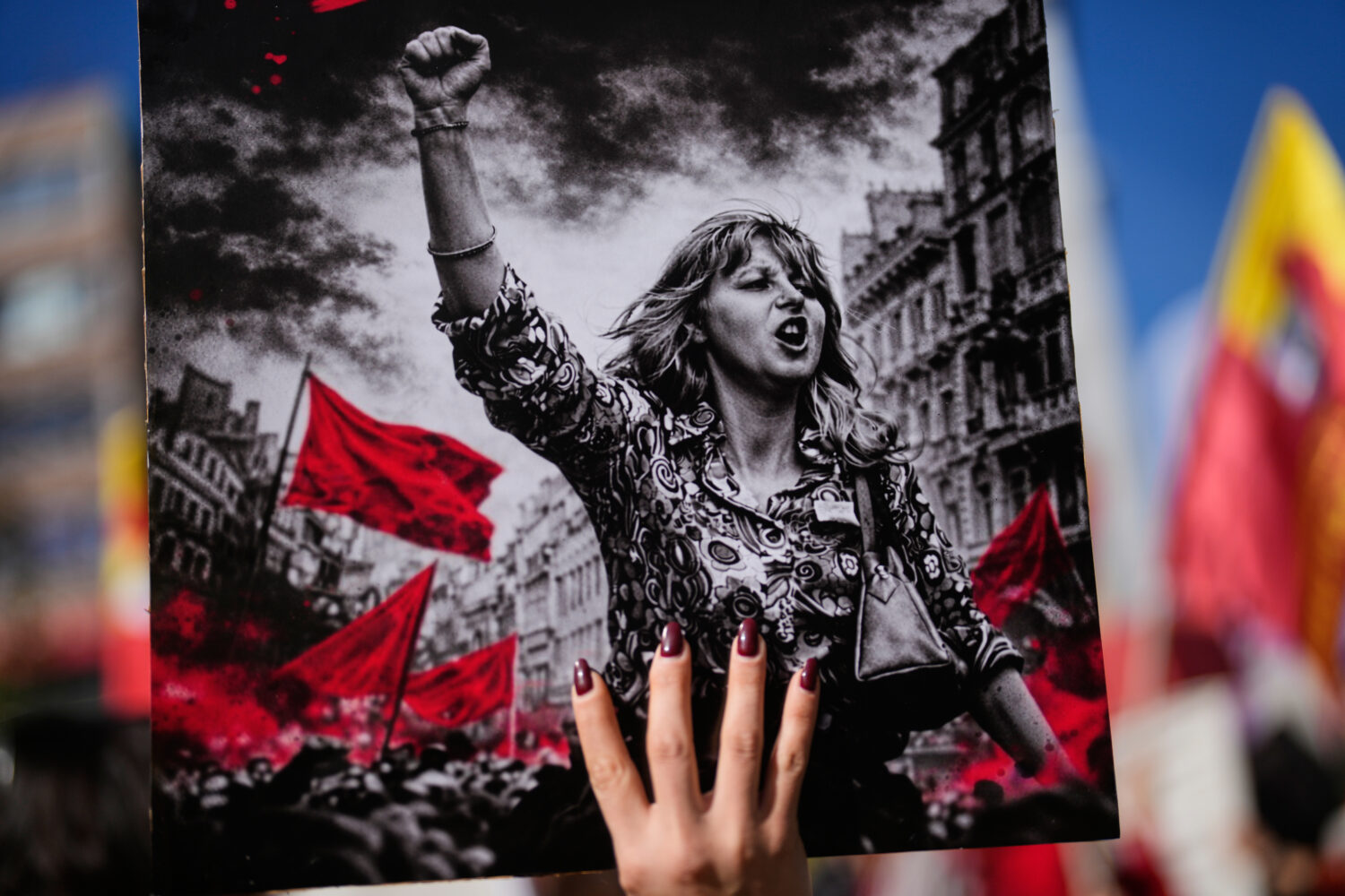 A woman holds up a placard during a protest marking the International Women's Day, in Istanbul, Tur...