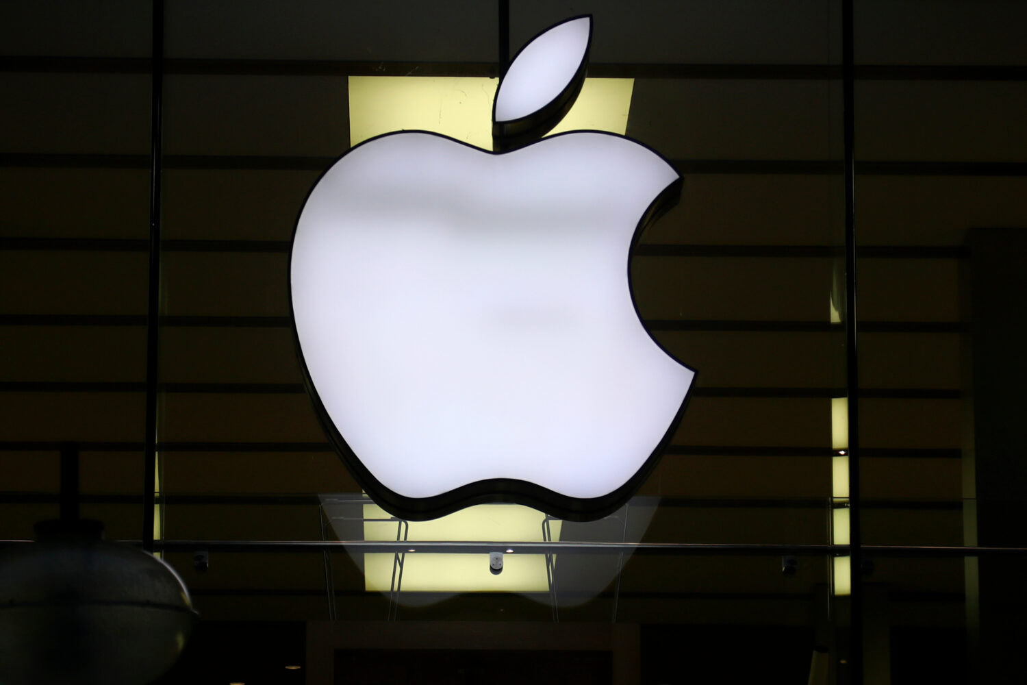 FILE - The logo of Apple is illuminated at a store in the city center in Munich, Germany, on Dec. 1...