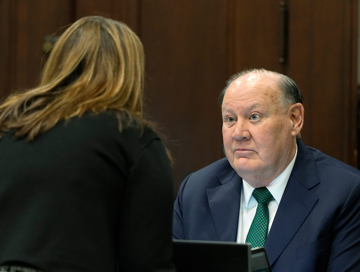 Defense attorney Rachael Israel talks chats with former FirstEnergy CEO Chuck Jones before the star...