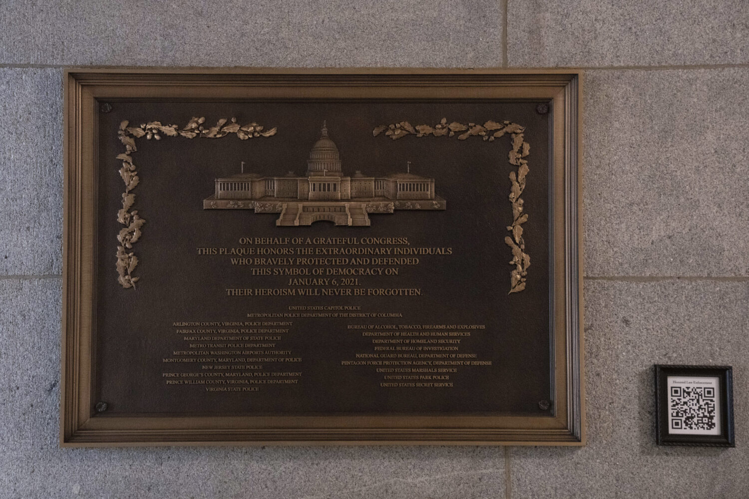 A plaque honoring police service on Jan. 6, 2021 at the Capitol, Saturday, March 7, 2026, in Washin...