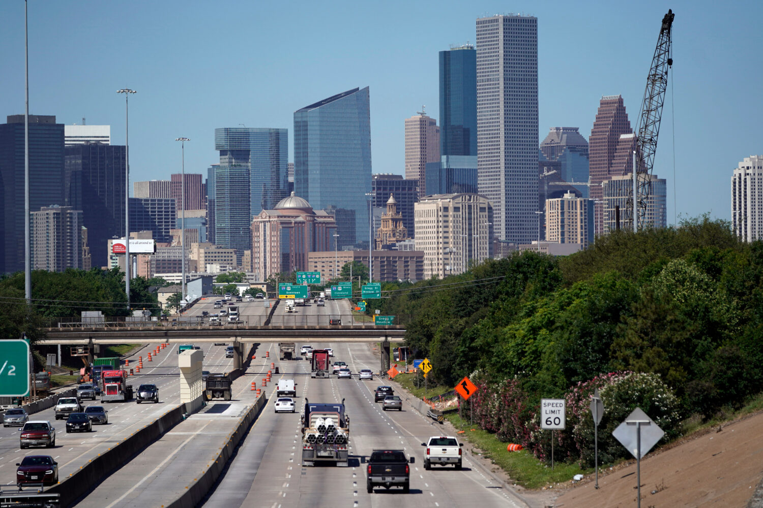 FILE - Traffic moves along Interstate 10 near downtown Houston, April 30, 2020. (AP Photo/David J. ...