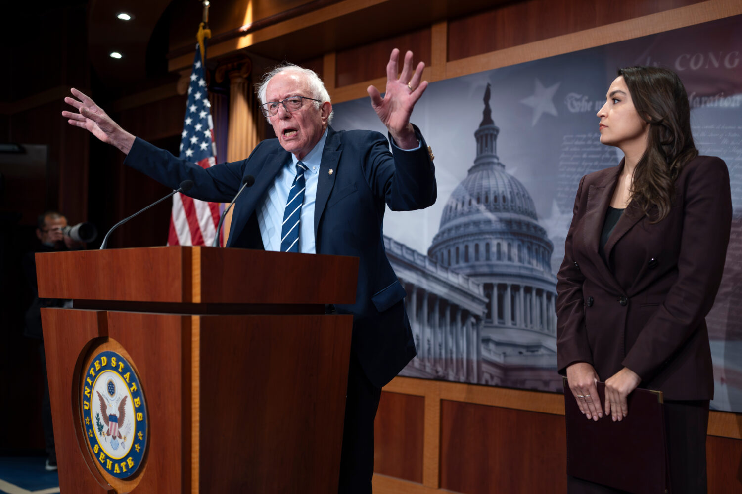 Sen. Bernie Sanders, I-Vt., left, and Rep. Alexandria Ocasio Cortez, D-N.Y., hold a news conference...