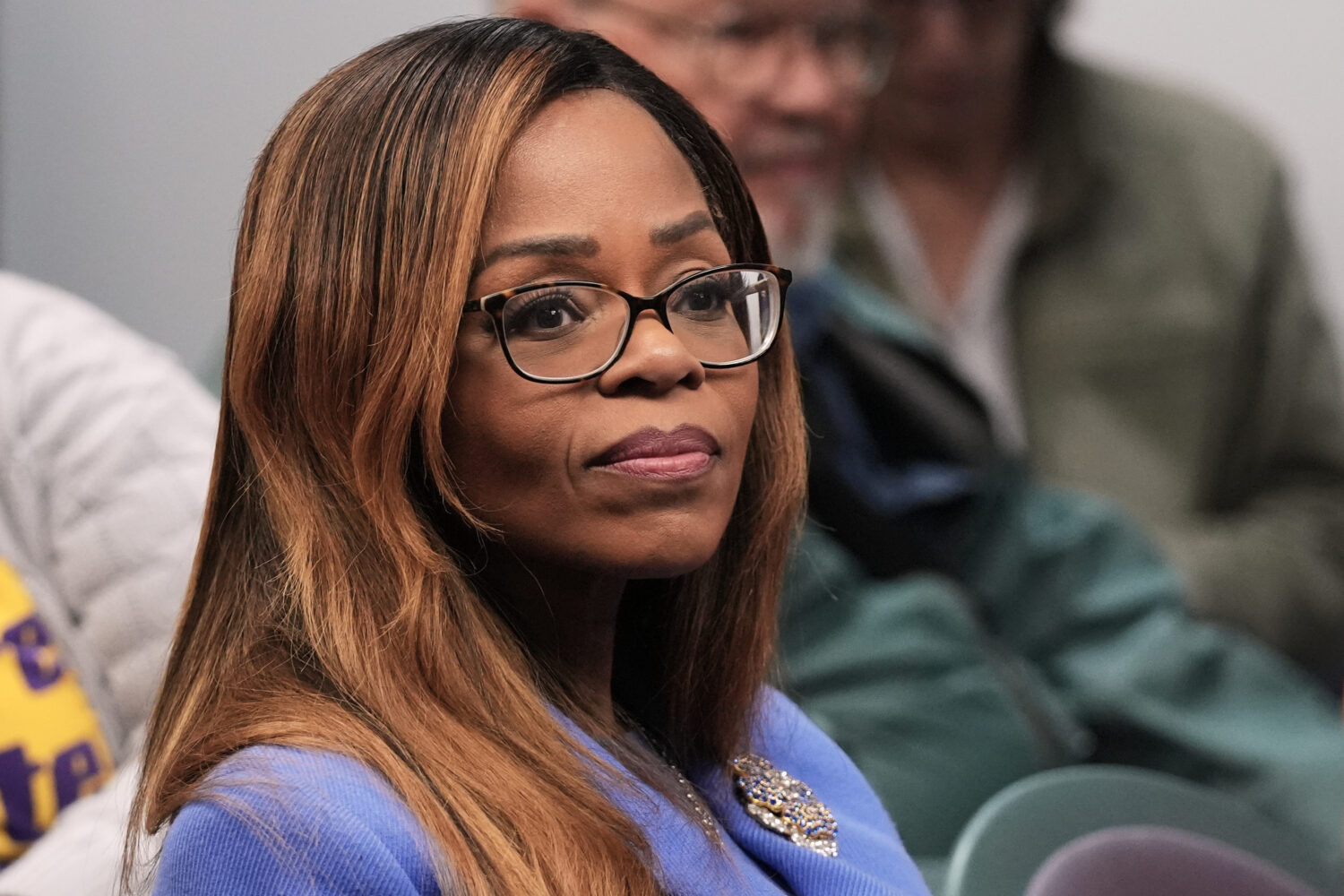 FILE - Rep. Sheila Cherfilus-McCormick, D-Fla., listens during a rally on Jan. 28, 2026, in support...