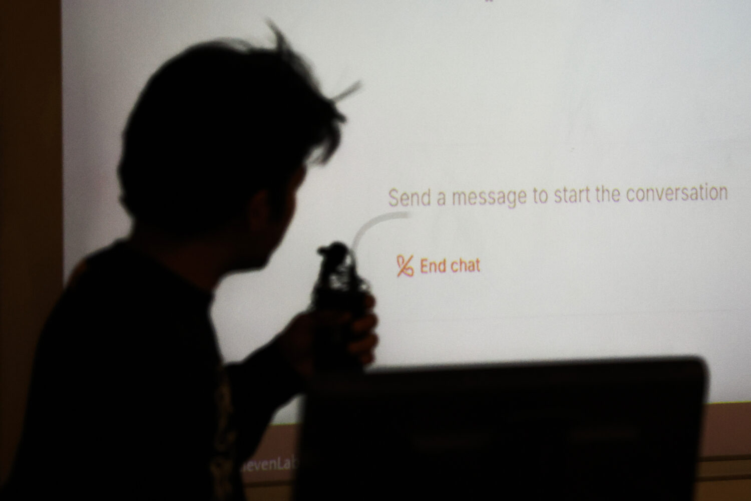 Student Surya Newa is silhouetted while using an oral AI agent during class at NYU Stern School of ...