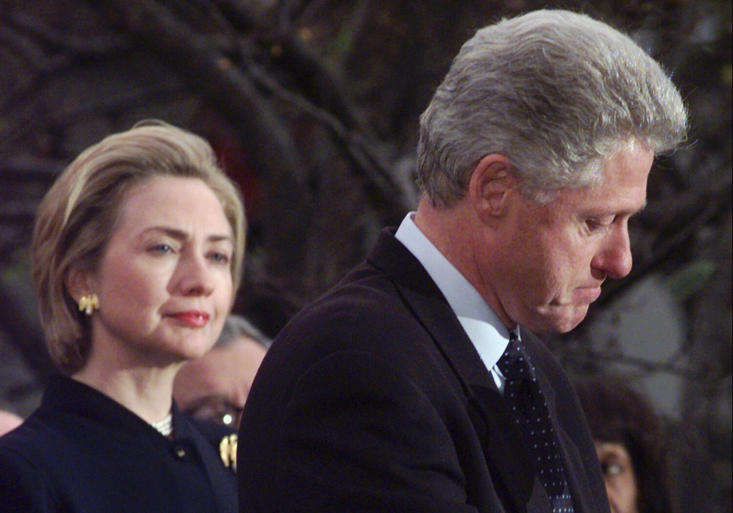 FILE - President Clinton makes a statement as first lady Hillary Clinton looks on at the White Hous...
