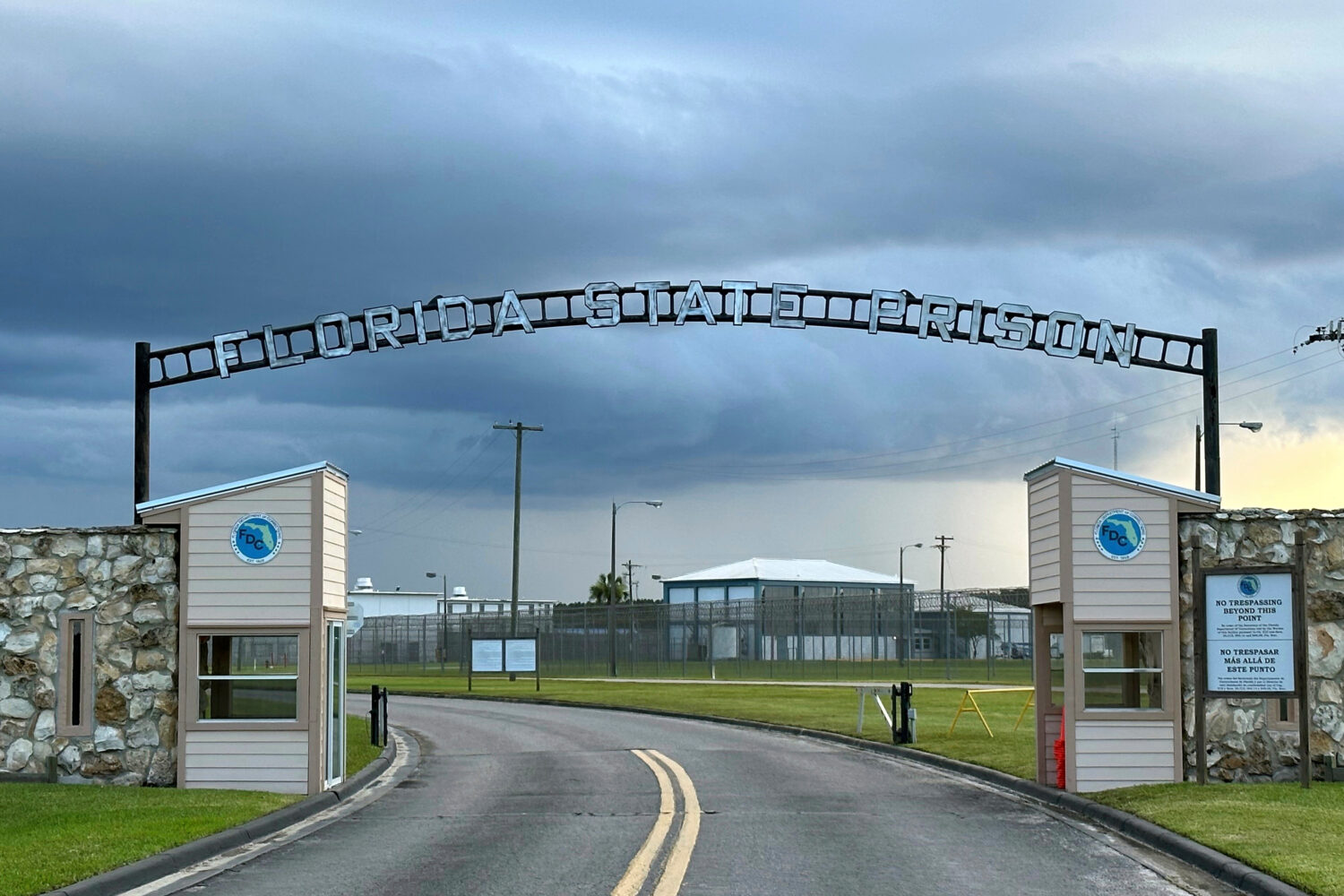 FILE - Clouds hover over the entrance of the Florida State Prison in Starke, Fla., Aug. 3, 2023. (A...