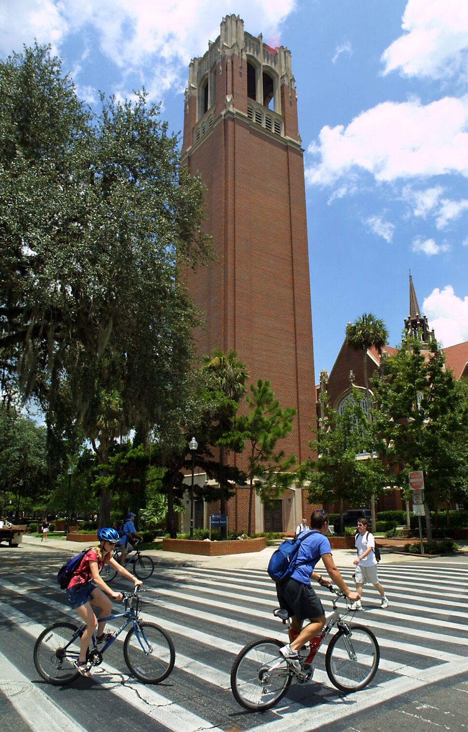 FILE - University of Florida students make their way through a crosswalk near the campus landmark C...