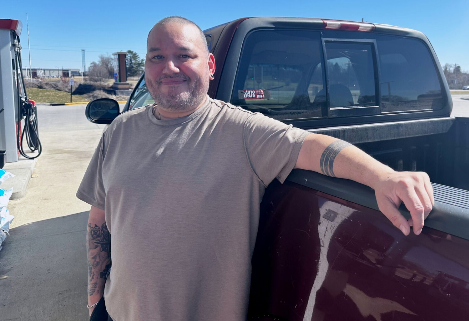 Francisco Castillo stands next to his son's Ford F-150 after filling up, Monday, March 9, 2026, at ...
