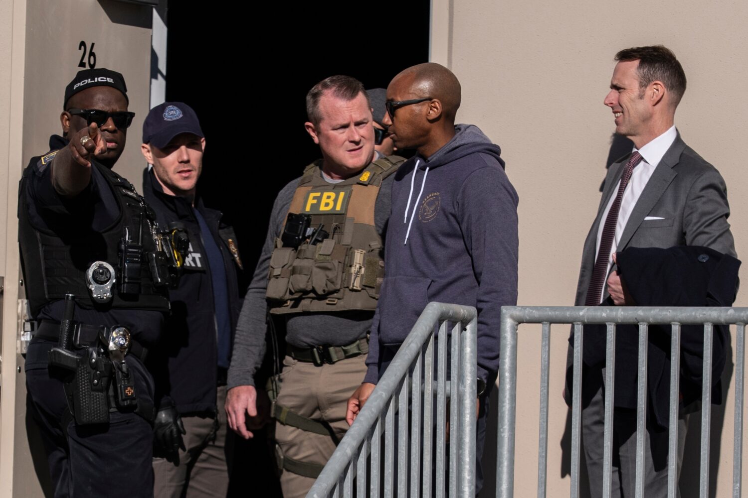 FILE - FBI agents are seen at the Fulton County Election Hub and Operation Center, Jan. 28, 2026, i...