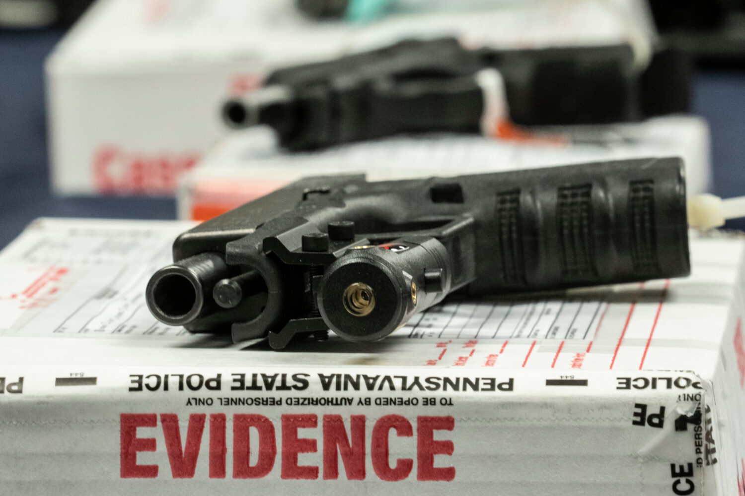 FILE - Shown are alleged straw purchased weapons displayed during a news conference in Norristown, ...