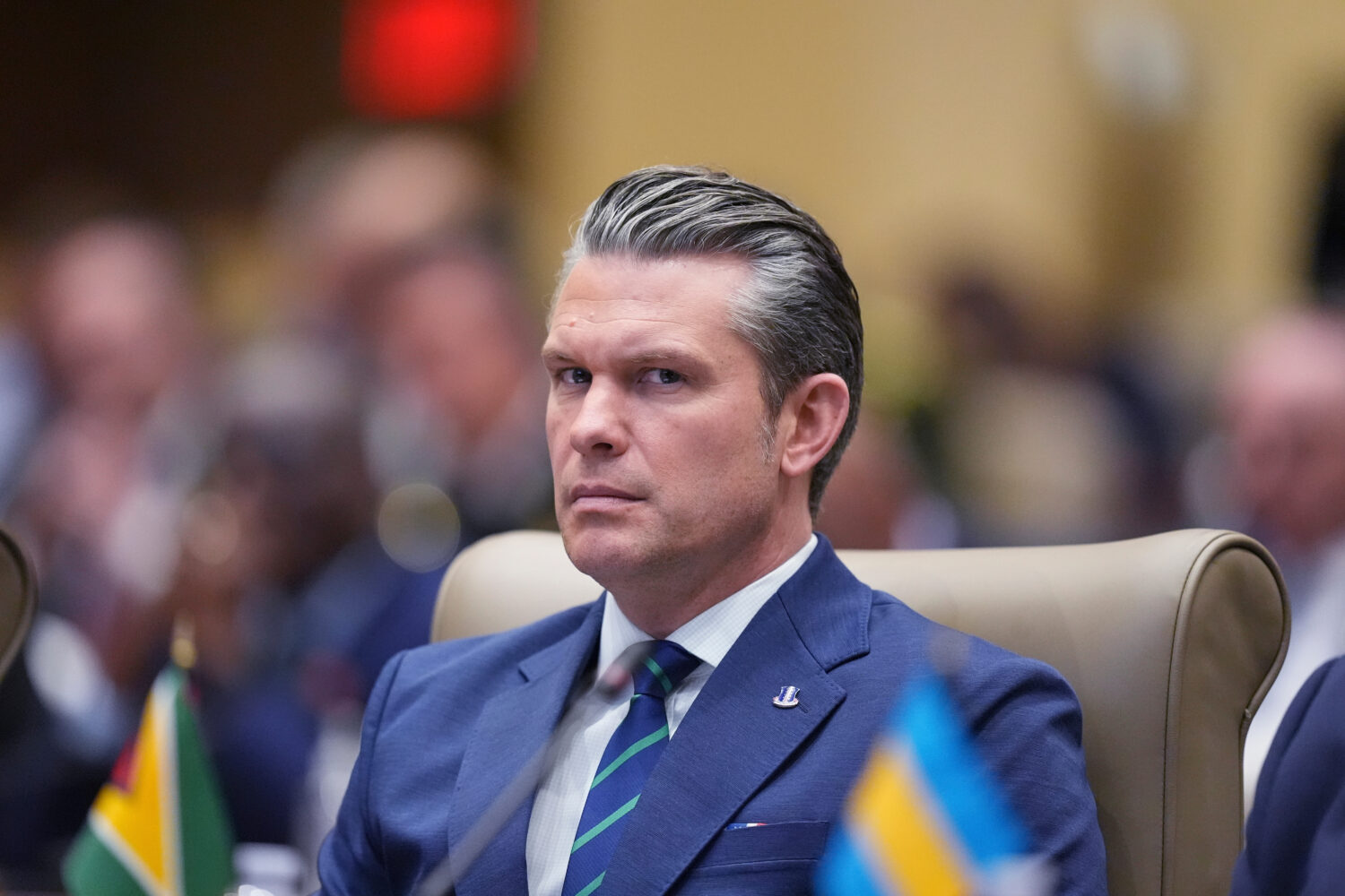 Defense Secretary Pete Hegseth listens during the inaugural Americas Counter Cartel Conference at U...