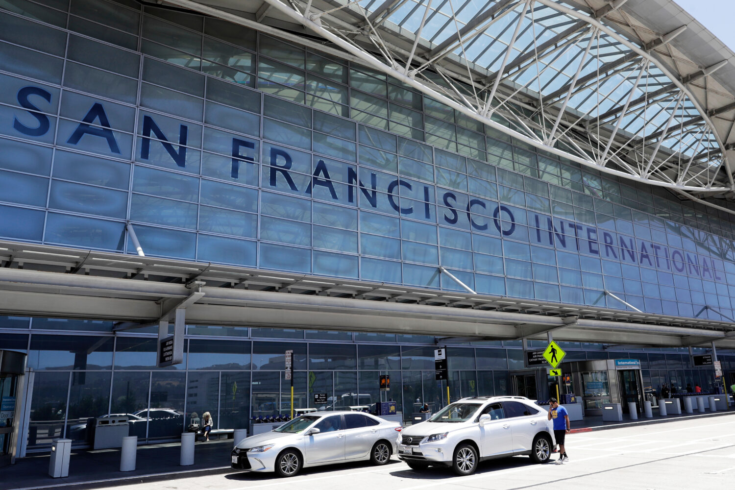 FILE - Vehicles wait outside the international terminal at San Francisco International Airport, in ...