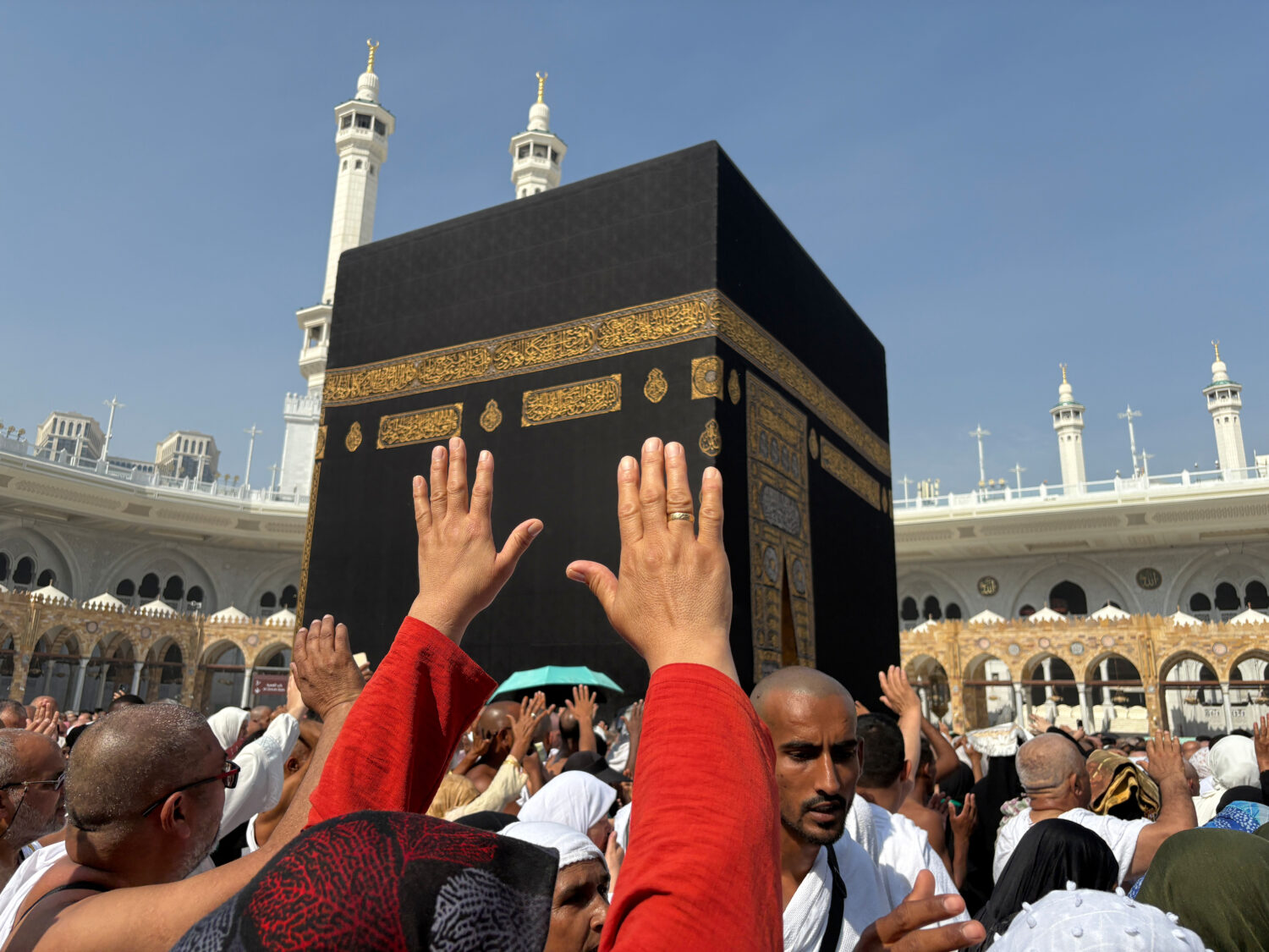 FILE - Muslim pilgrims pray as they circumambulate the Kaaba, the cubic building at the Grand Mosqu...
