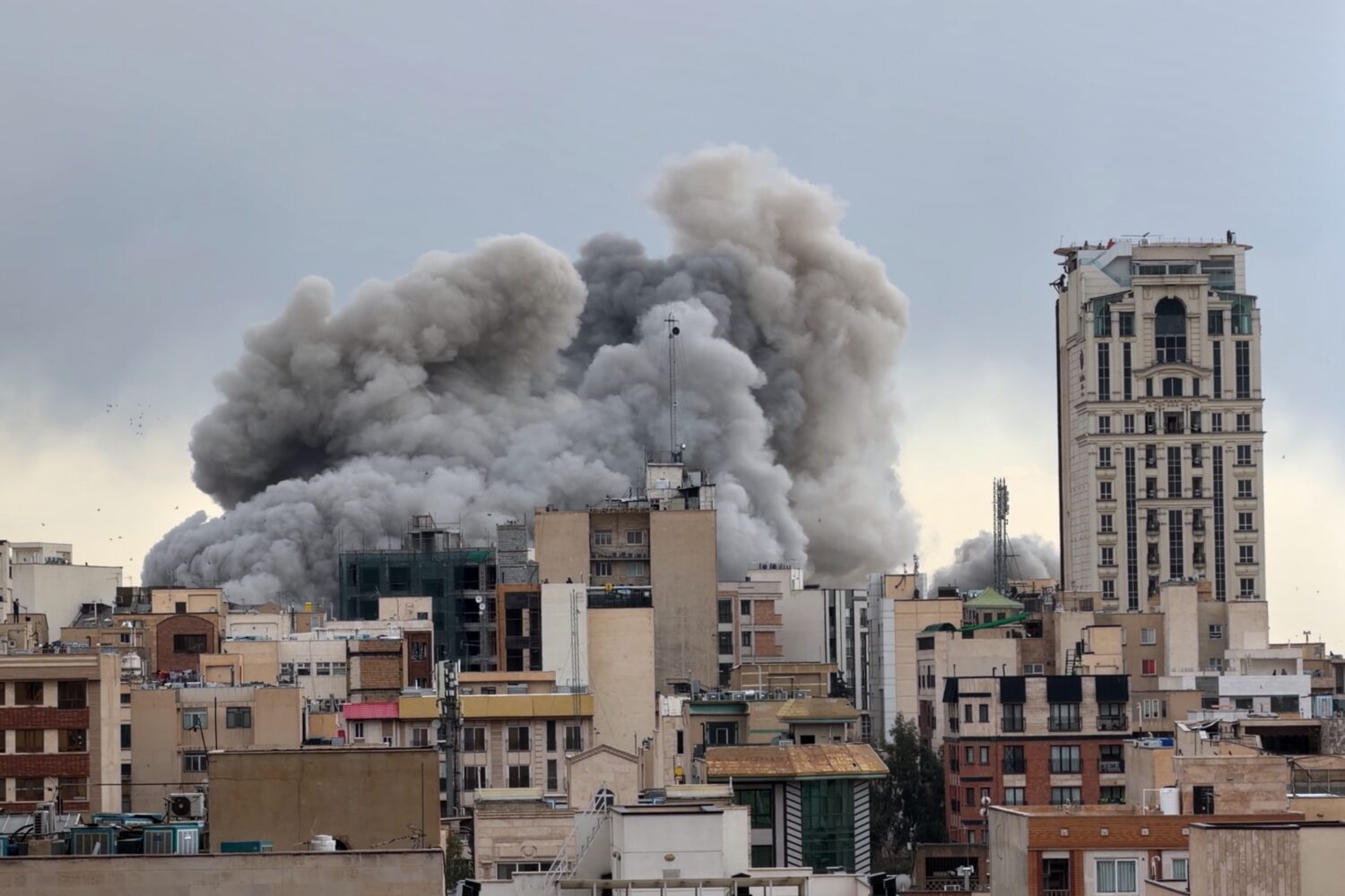 FILE - A plume of smoke rises after a strike in Tehran, Iran, Monday, March 2, 2026. (AP Photo/Mohs...