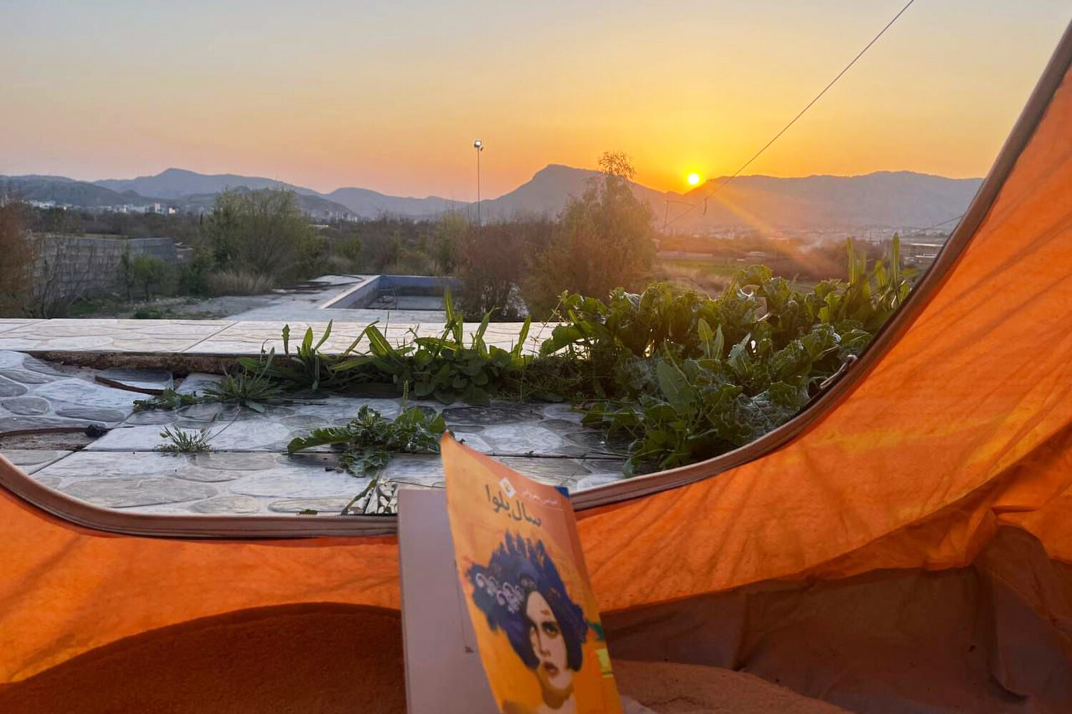 This photo provided by an Iranian lawyer who did not want to be identified, shows the backyard of h...