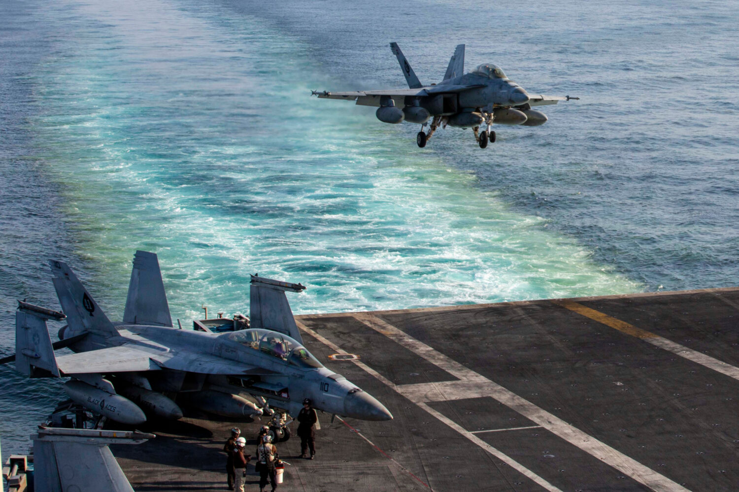 This image provided by U.S. Central Command shows a F/A-18E Super Hornet preparing to make an arres...