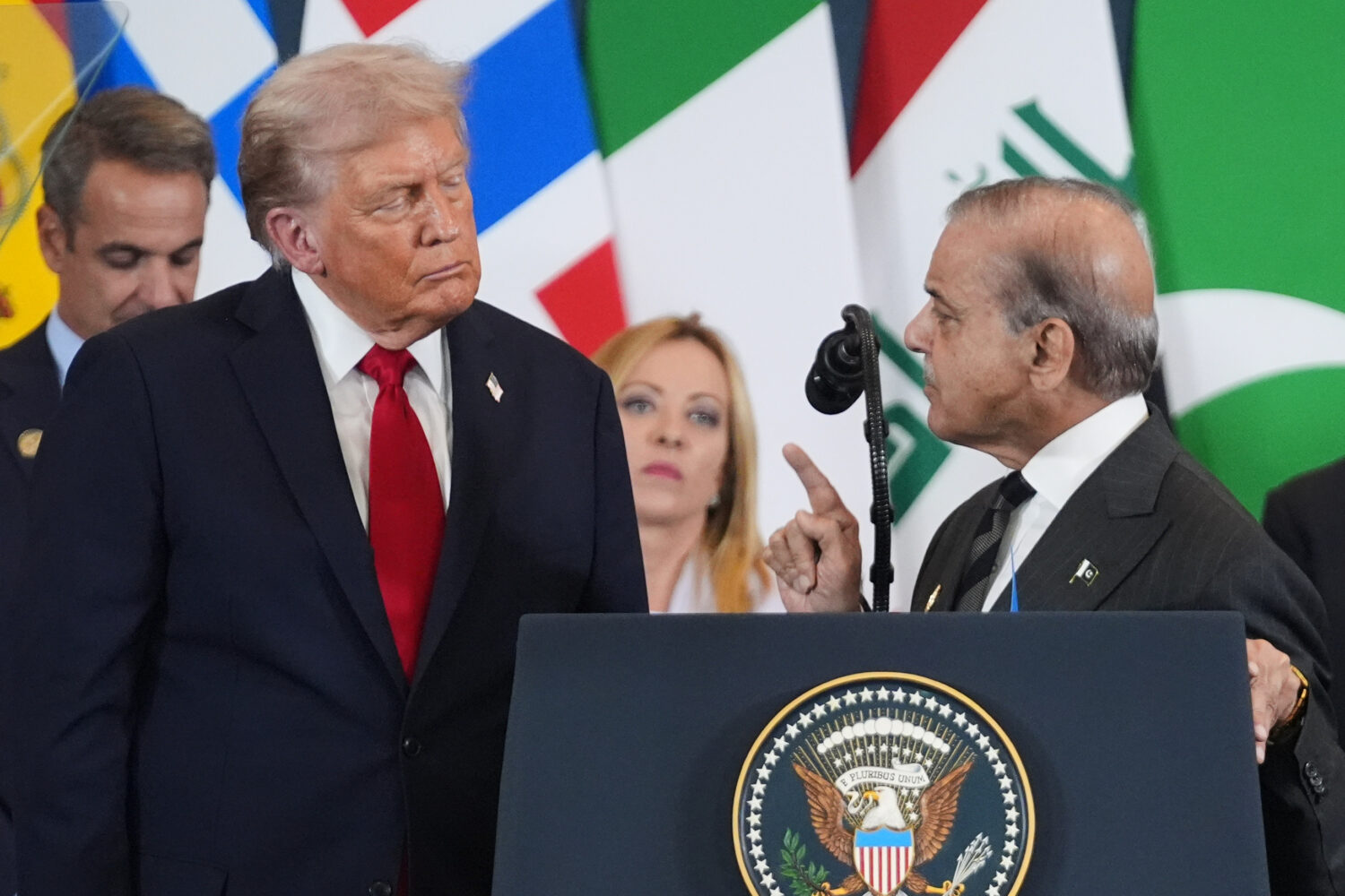 FILE - President Donald Trump, left, listens as Pakistan's Prime Minister Shehbaz Sharif speaks dur...