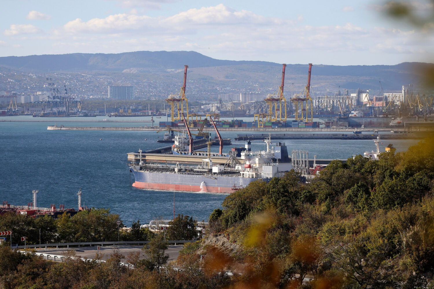FILE - An oil tanker is moored at the Sheskharis complex in Novorossiysk, Russia, Tuesday, Oct. 11,...