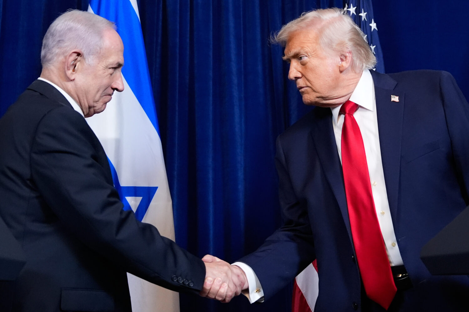 FILE - President Donald Trump shakes hands with Israel's Prime Minister Benjamin Netanyahu during a...