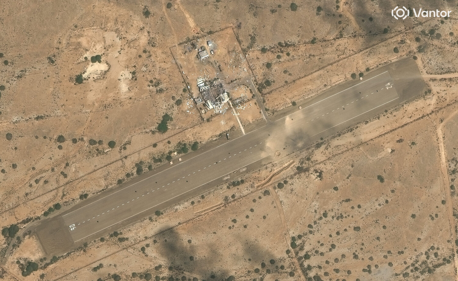 This satellite image provided by Vantor shows a destroyed drone storage building and cratered airst...