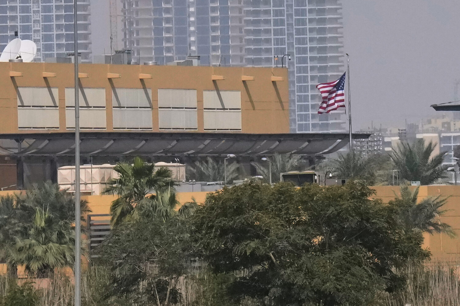 U.S. Embassy is seen across the Tigris River in Baghdad, Sunday, March 8, 2026. (AP Photo/Hadi Mizb...
