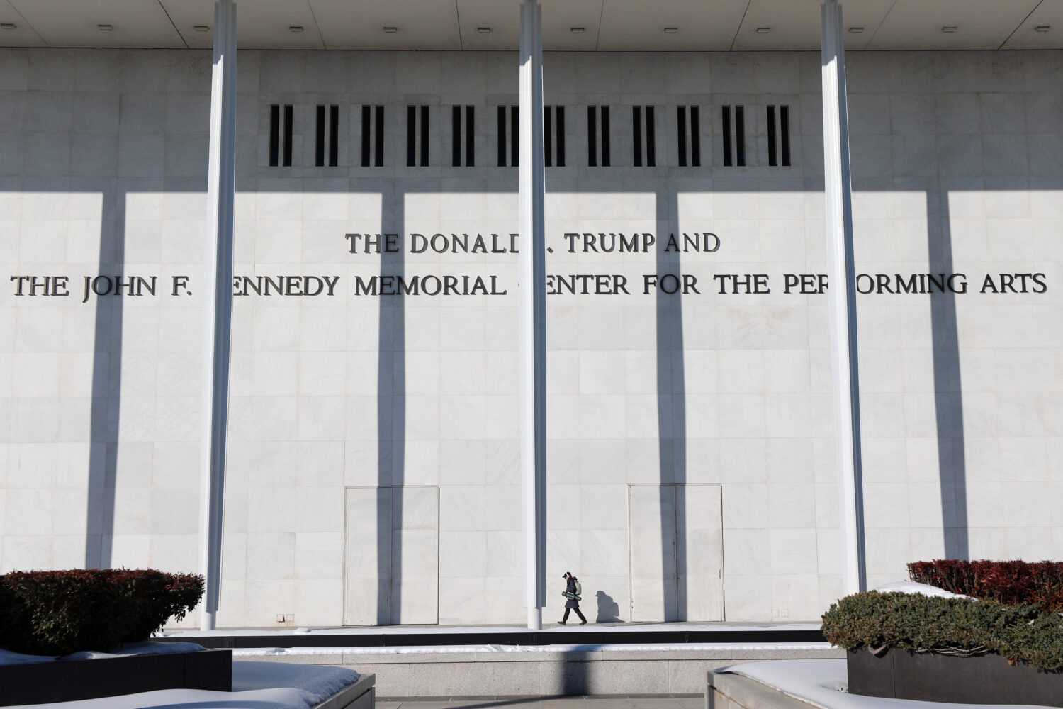 FILE - A woman walks outside The John F. Kennedy Memorial Center For The Performing Arts on Feb. 2,...