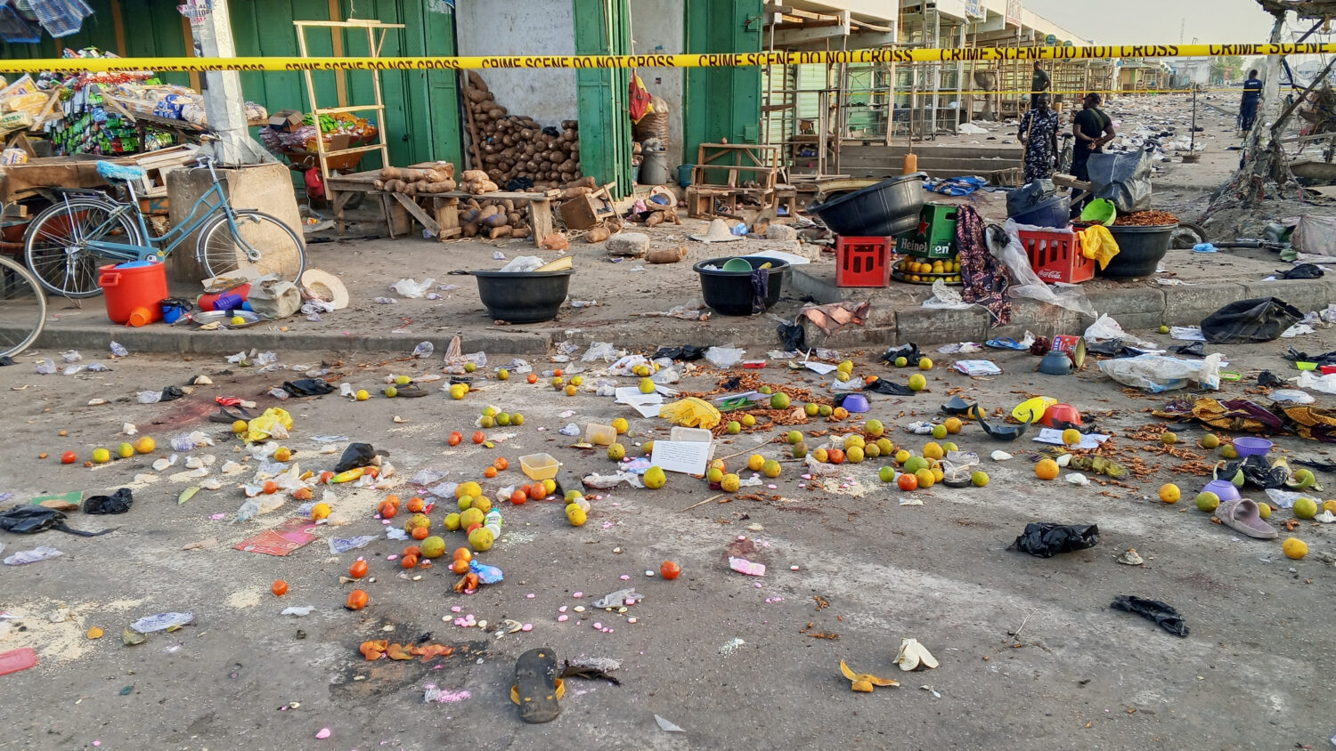Police officers are seen at the scene of a bomb blast at a market in Maiduguri, Nigeria, Tuesday, M...