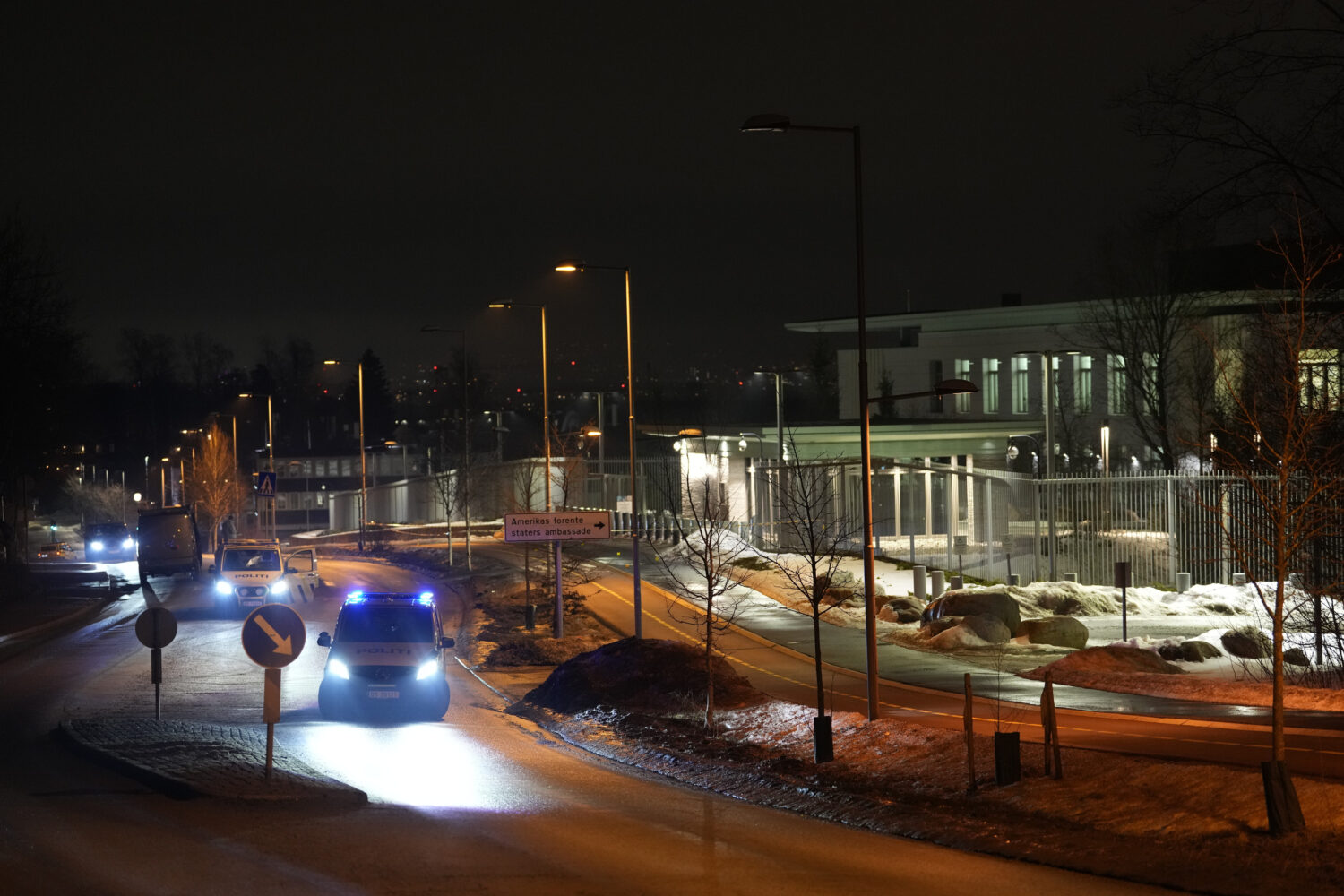 Norwegian police attend outside the U.S. Embassy in Oslo, Norway in the early hours of Sunday, Marc...