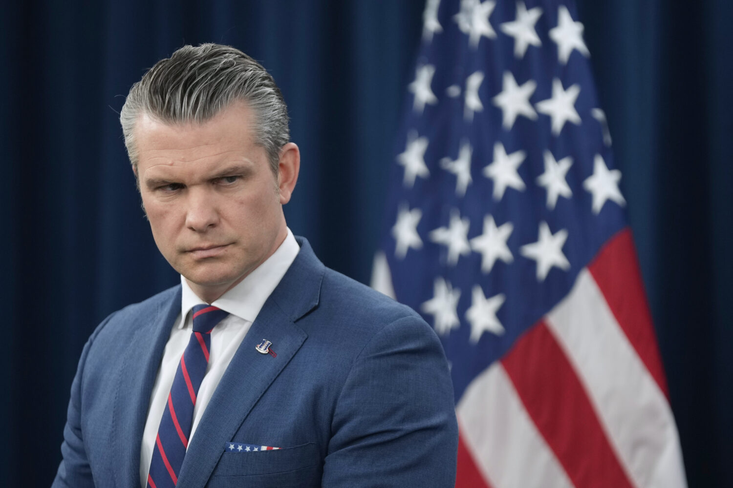 Defense Secretary Pete Hegseth listens during a press briefing at the Pentagon, Monday, March 2, 20...