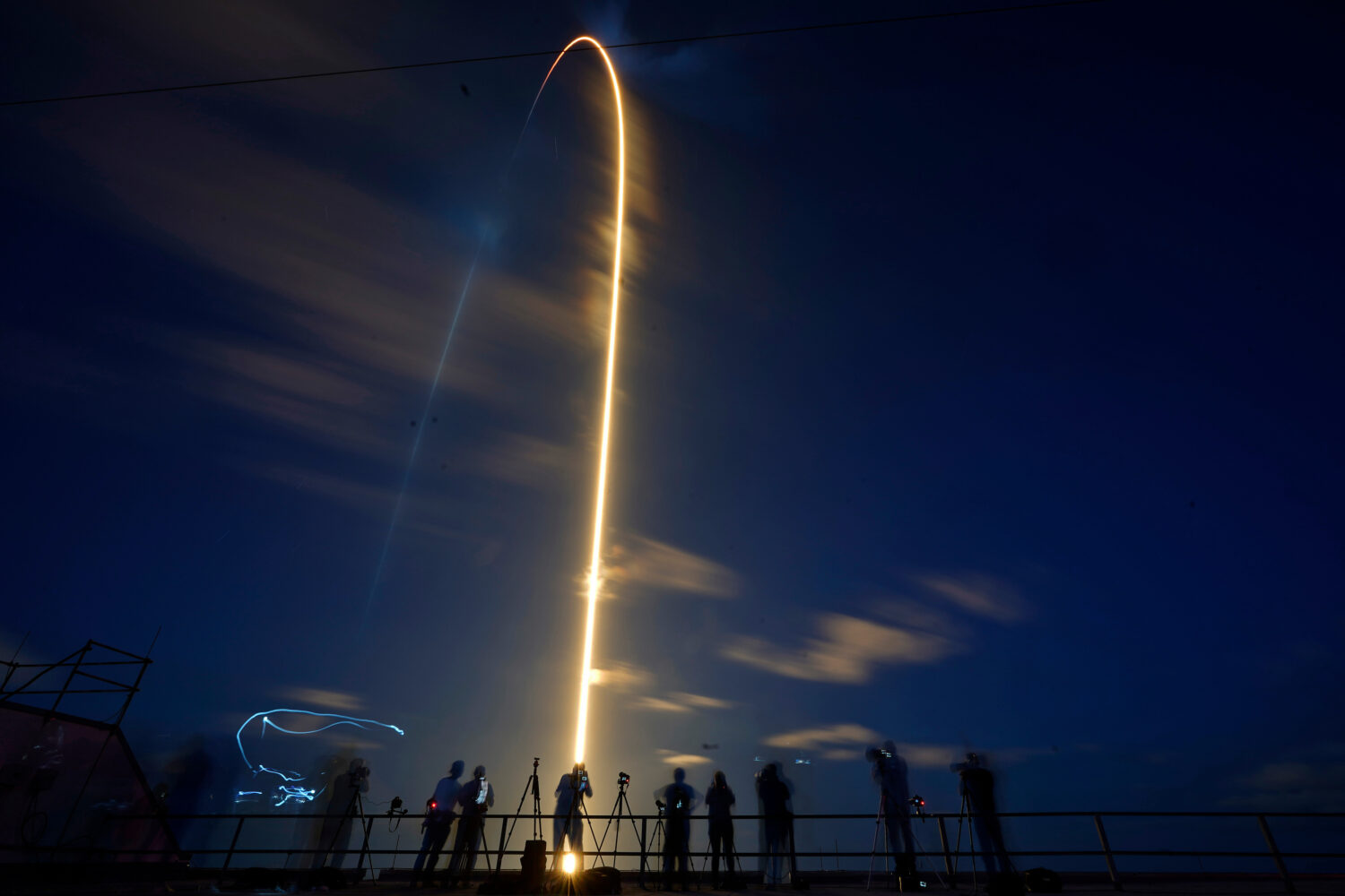 FILE - In this photo made with a long exposure, a SpaceX Falcon 9 rocket, with four private citizen...