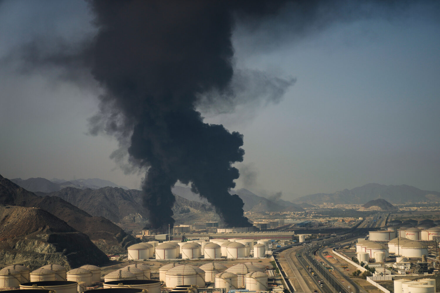 Plumes of smoke rise from an oil facility in Fujairah, United Arab Emirates, Saturday, March 14, 20...