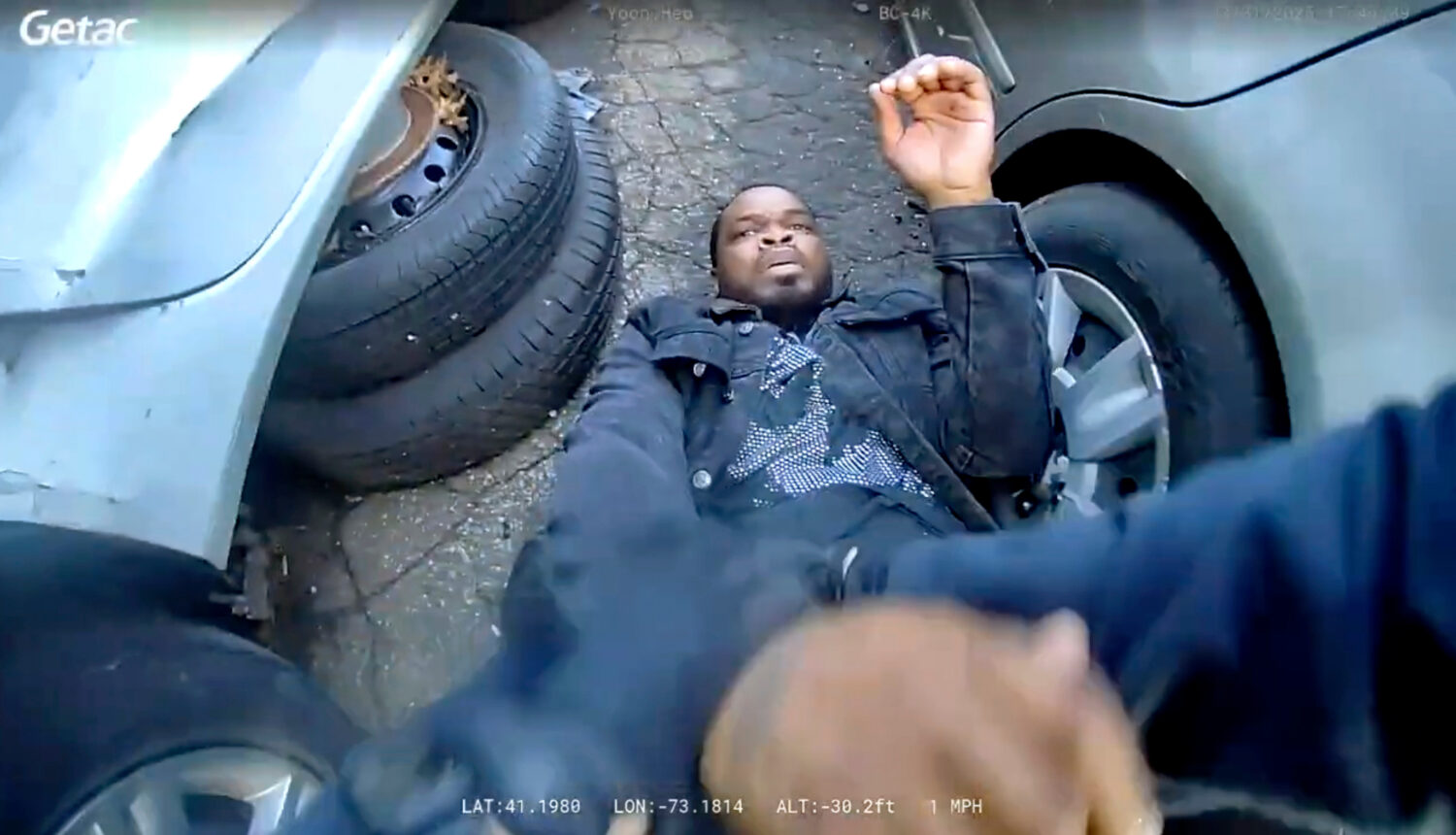In this photo taken from video released by the Bridgeport Police Department, Dyshan Best looks up a...