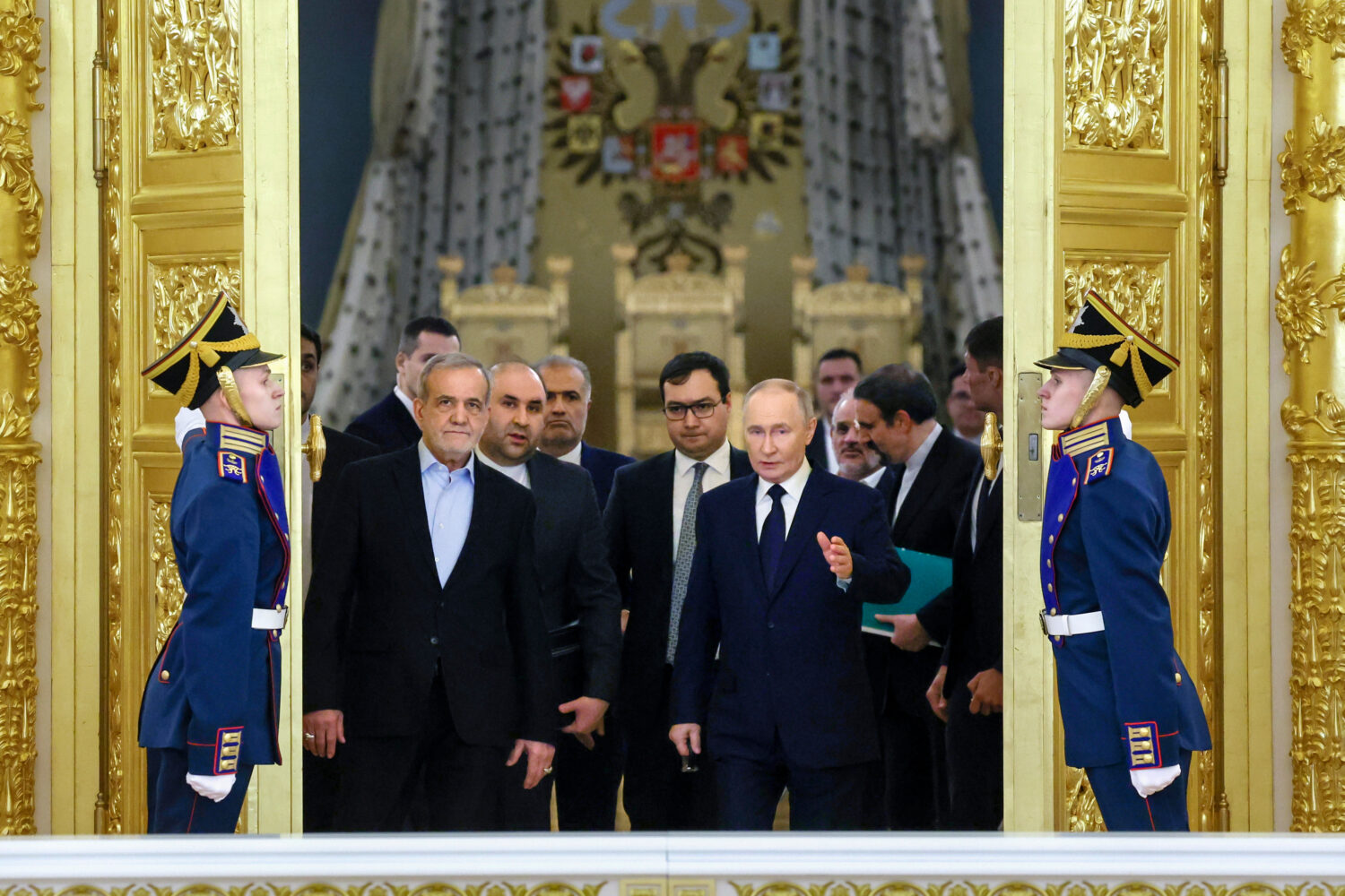 FILE - Iranian President Masoud Pezeshkian, center left, and Russian President Vladimir Putin, cent...