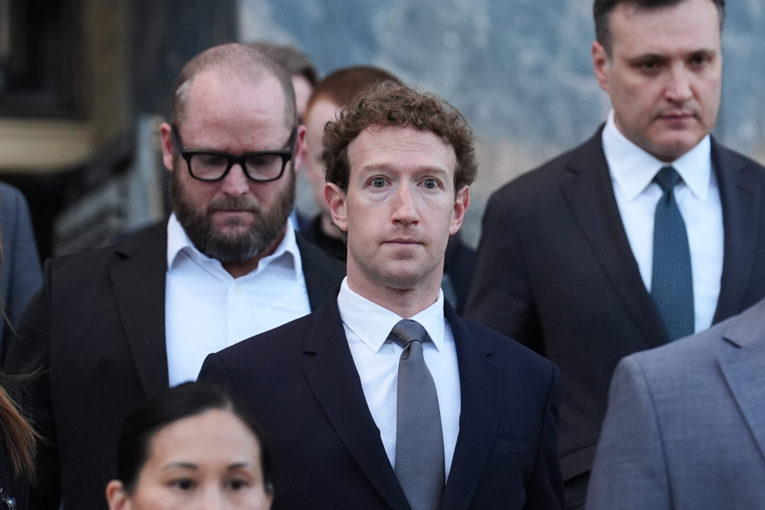Meta CEO Mark Zuckerberg leaves after testifying in a landmark trial over whether social media plat...