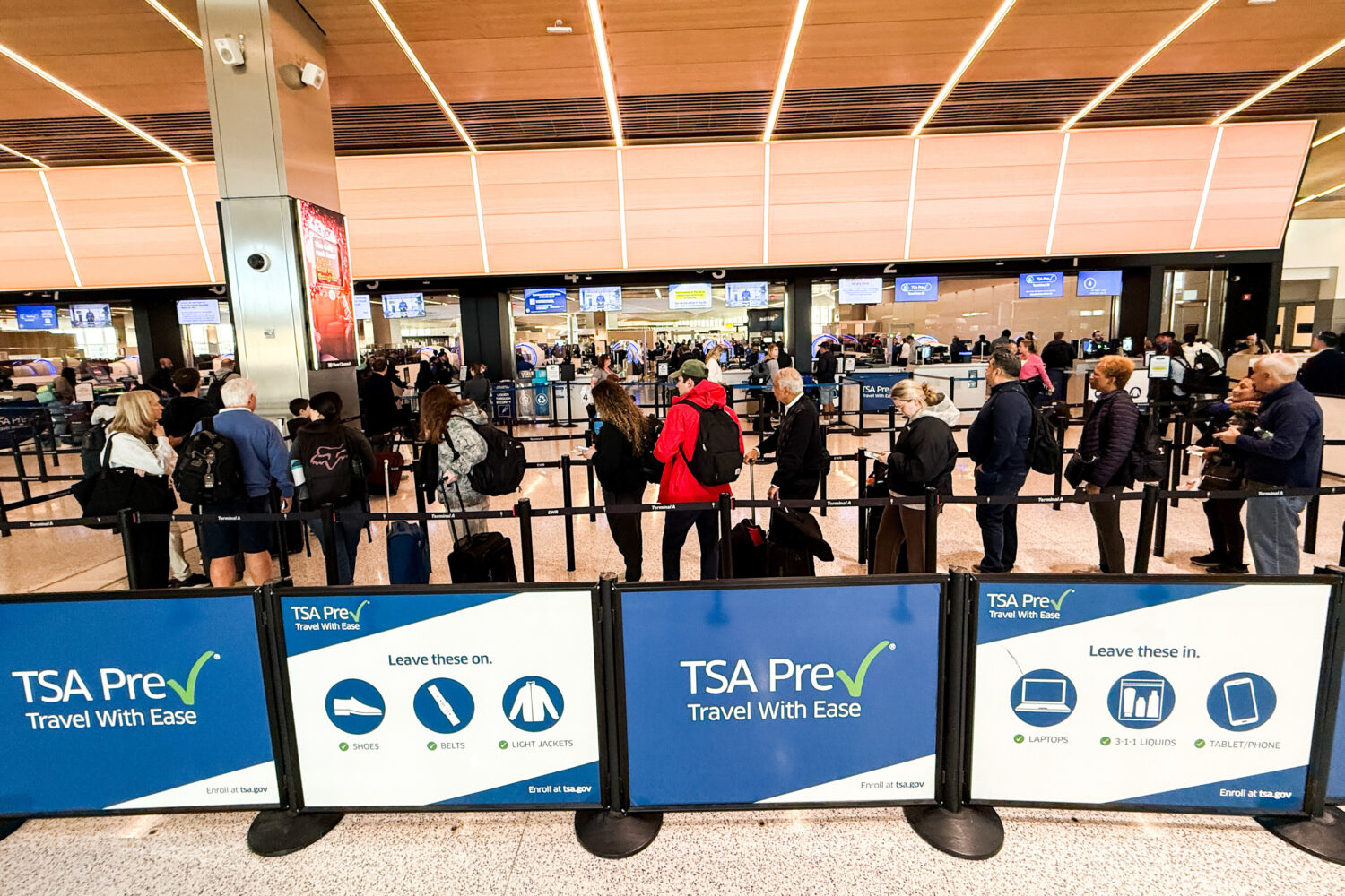 People wait in a TSA security line at Terminal A of Newark Liberty International Airport (EWR) in N...