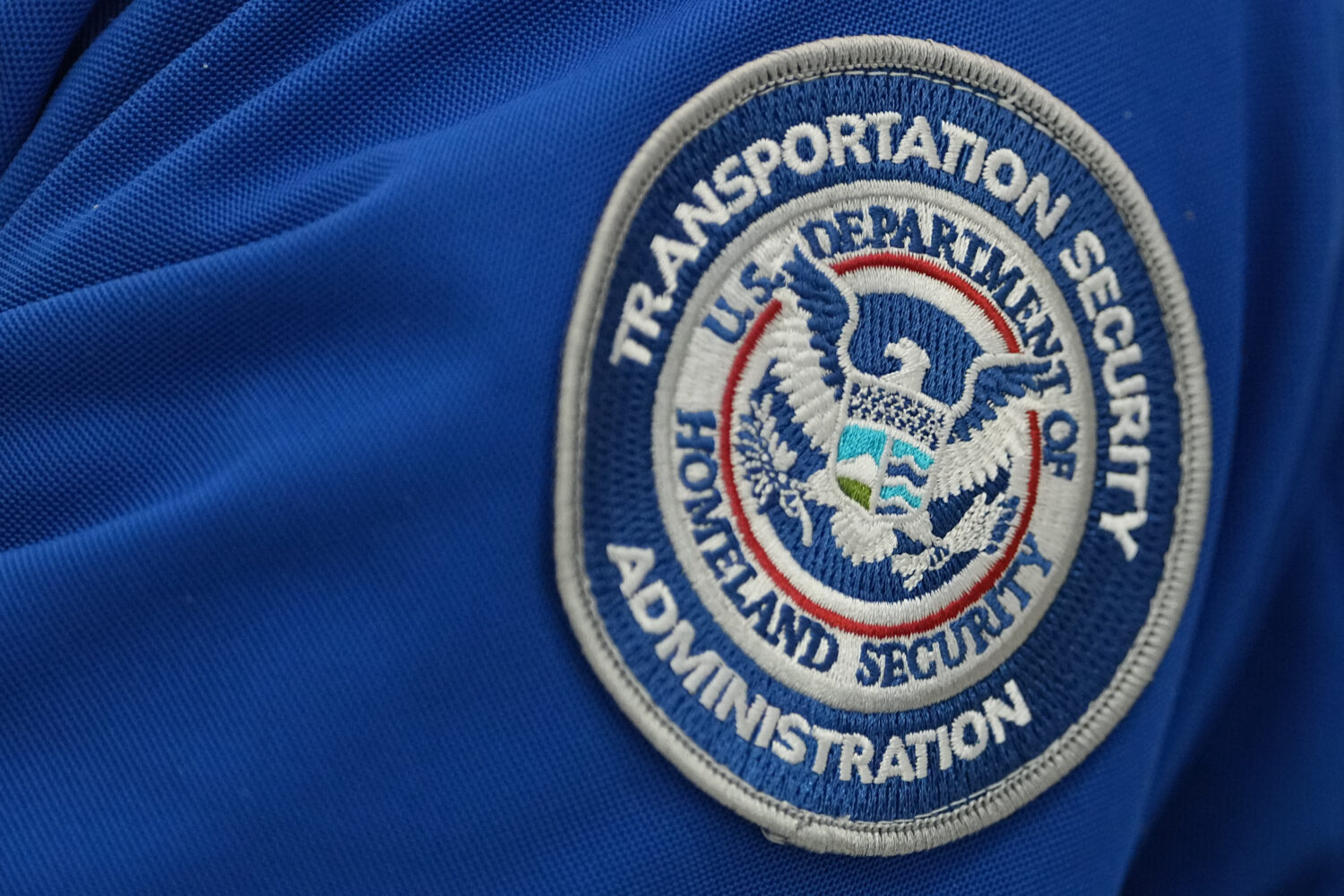 A Transportation Security Administration (TSA) workers's patch is displayed at Philadelphia Interna...