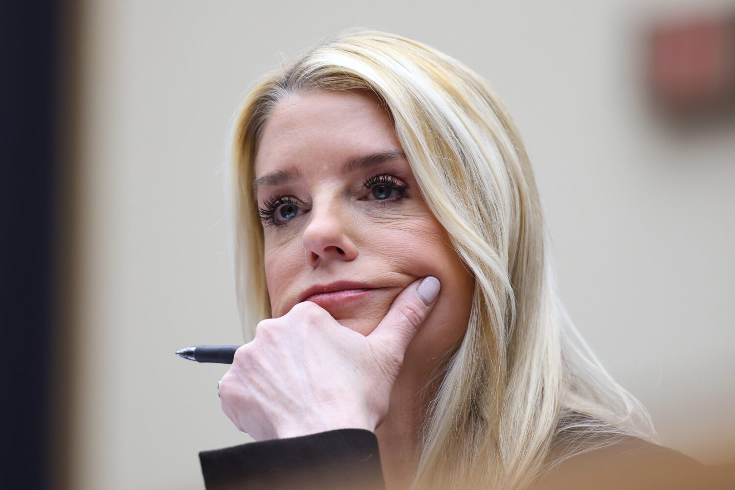 FILE - Attorney General Pam Bondi listens as she testifies before a House Judiciary Committee overs...