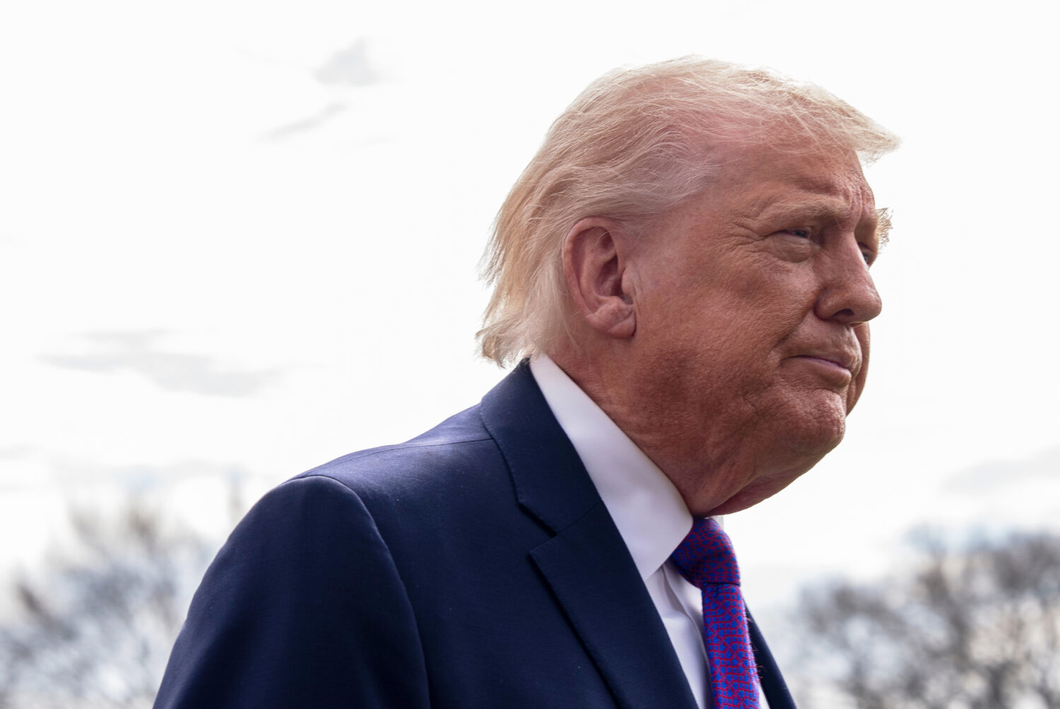 President Donald Trump speaks with reporters before departing on Marine One from the South Lawn of ...