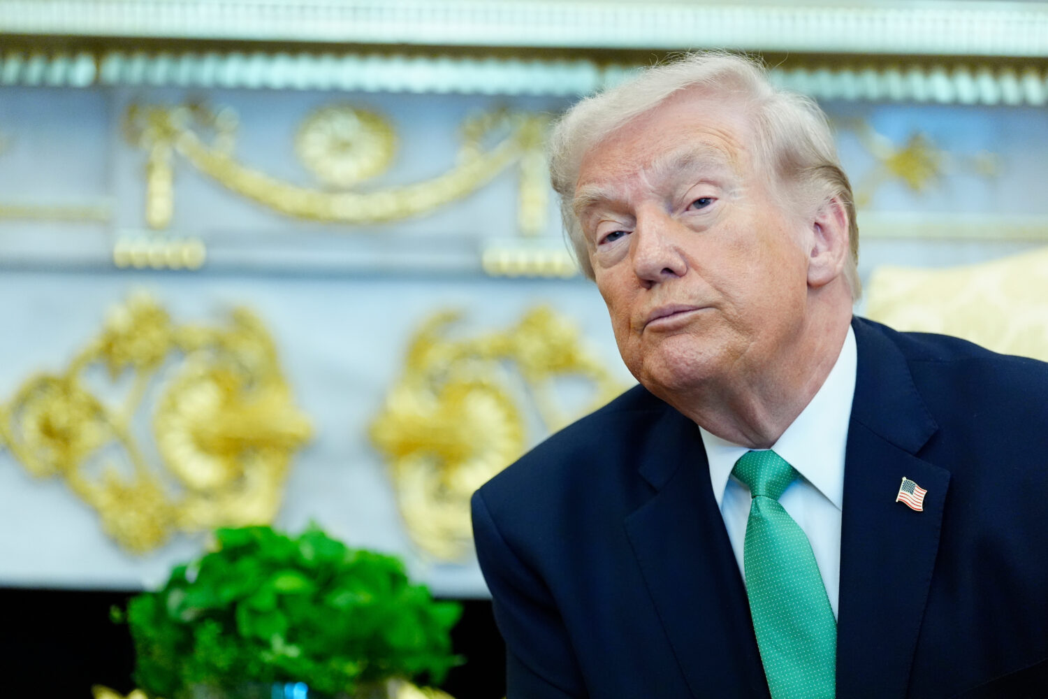 President Donald Trump listens to a reporter's question during a meeting with Irish Prime Minister ...