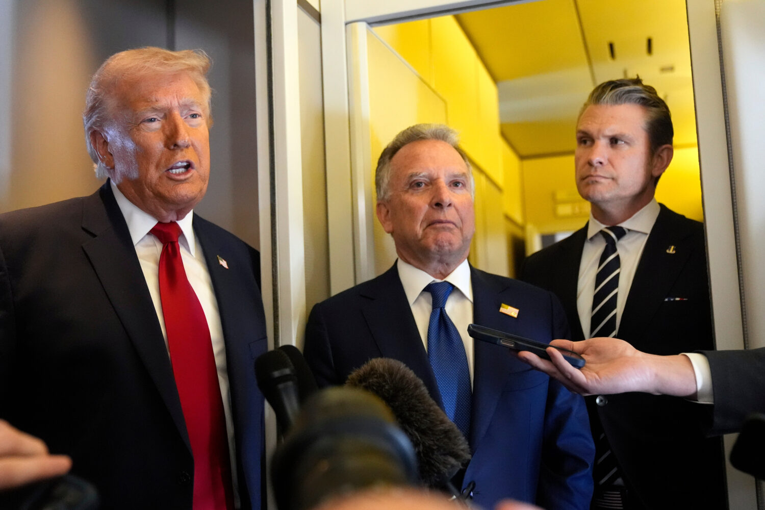 President Donald Trump speaks to reporters as White House Special Envoy to the Middle East Steve Wi...