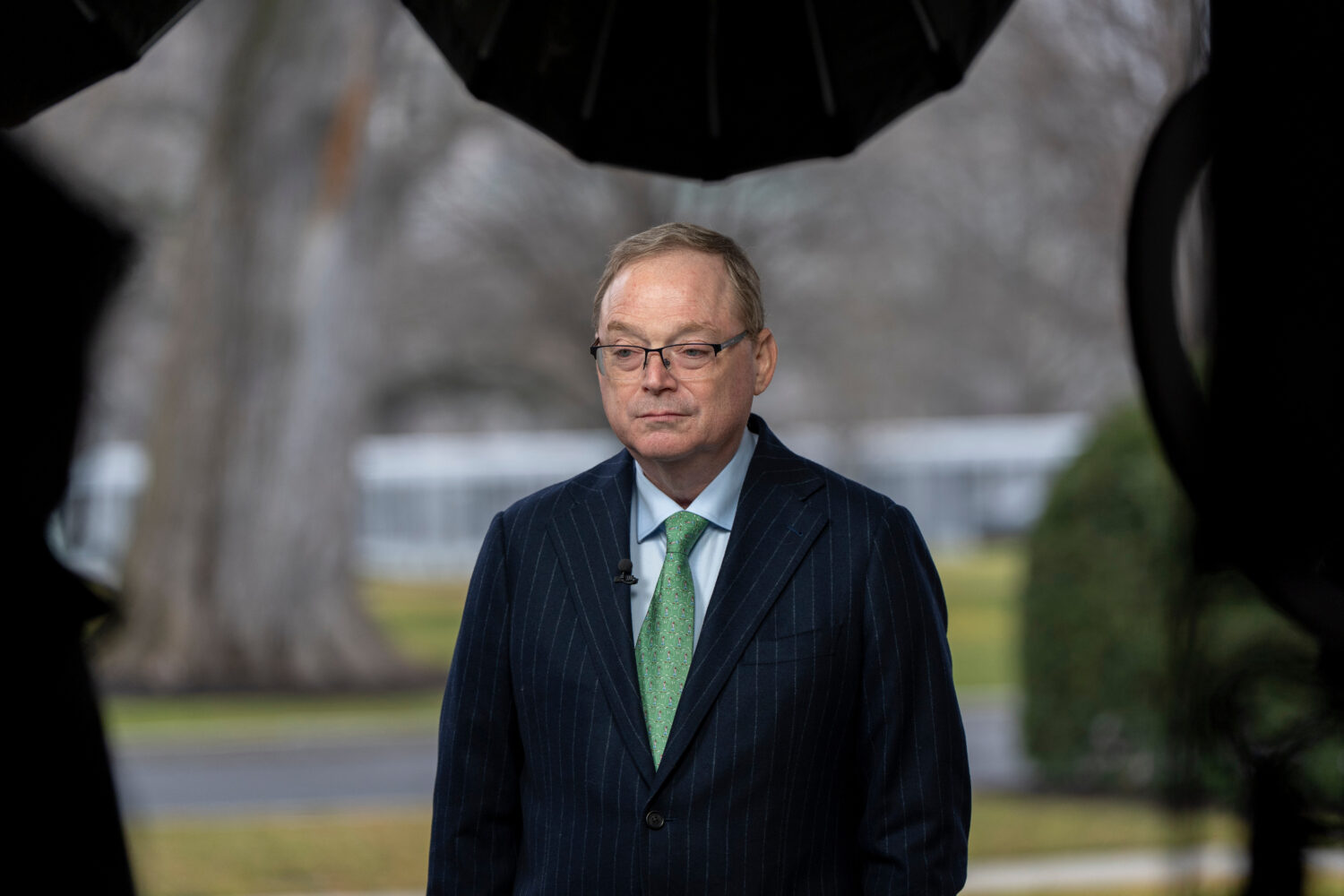 Director of the White House National Economic Council Kevin Hassett stands before a television inte...