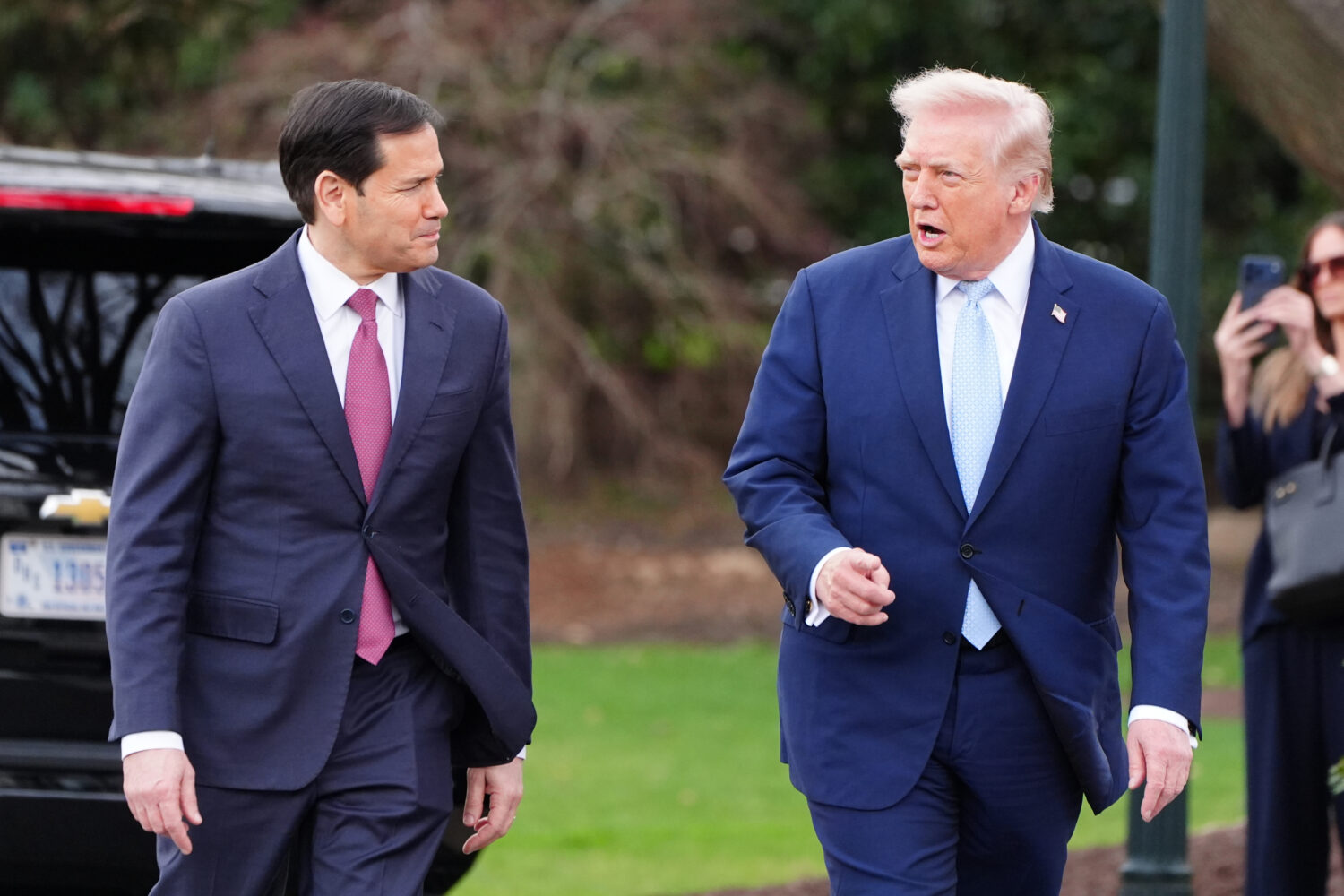 President Donald Trump walks with Secretary of State Marco Rubio before departing on Marine One fro...