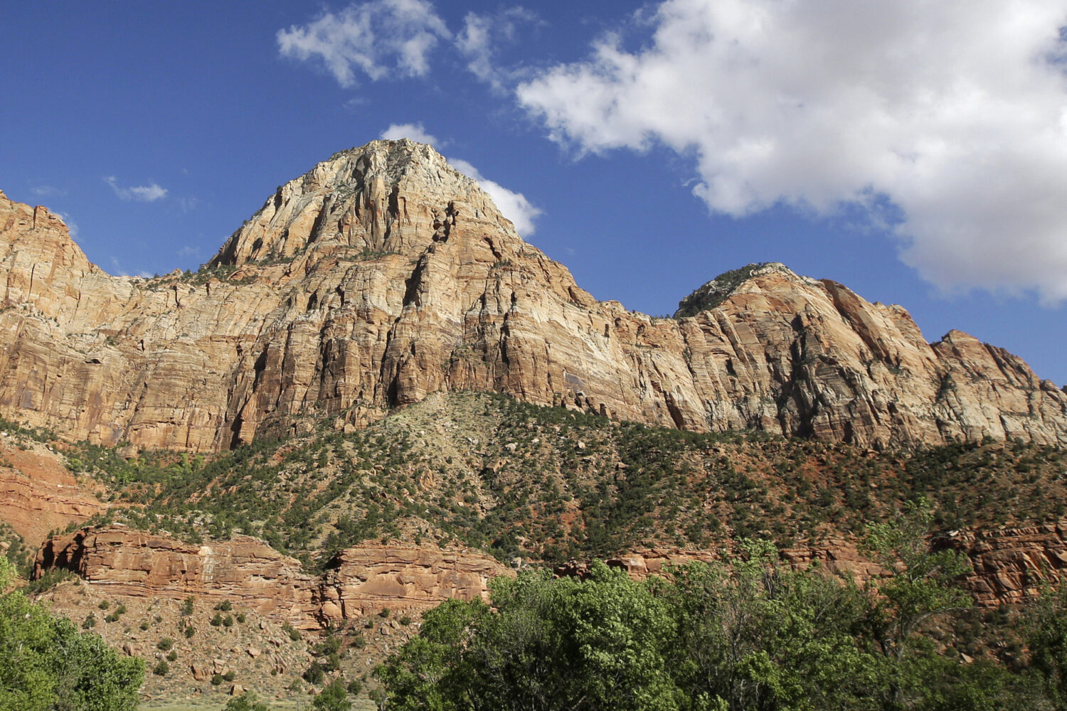 FILE - Sheer cliffs rise at Zion National Park, near Springdale, Utah., Sept. 16, 2015. (AP Photo/R...
